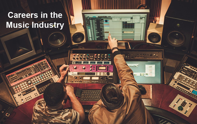 Two people inside a studio working on music