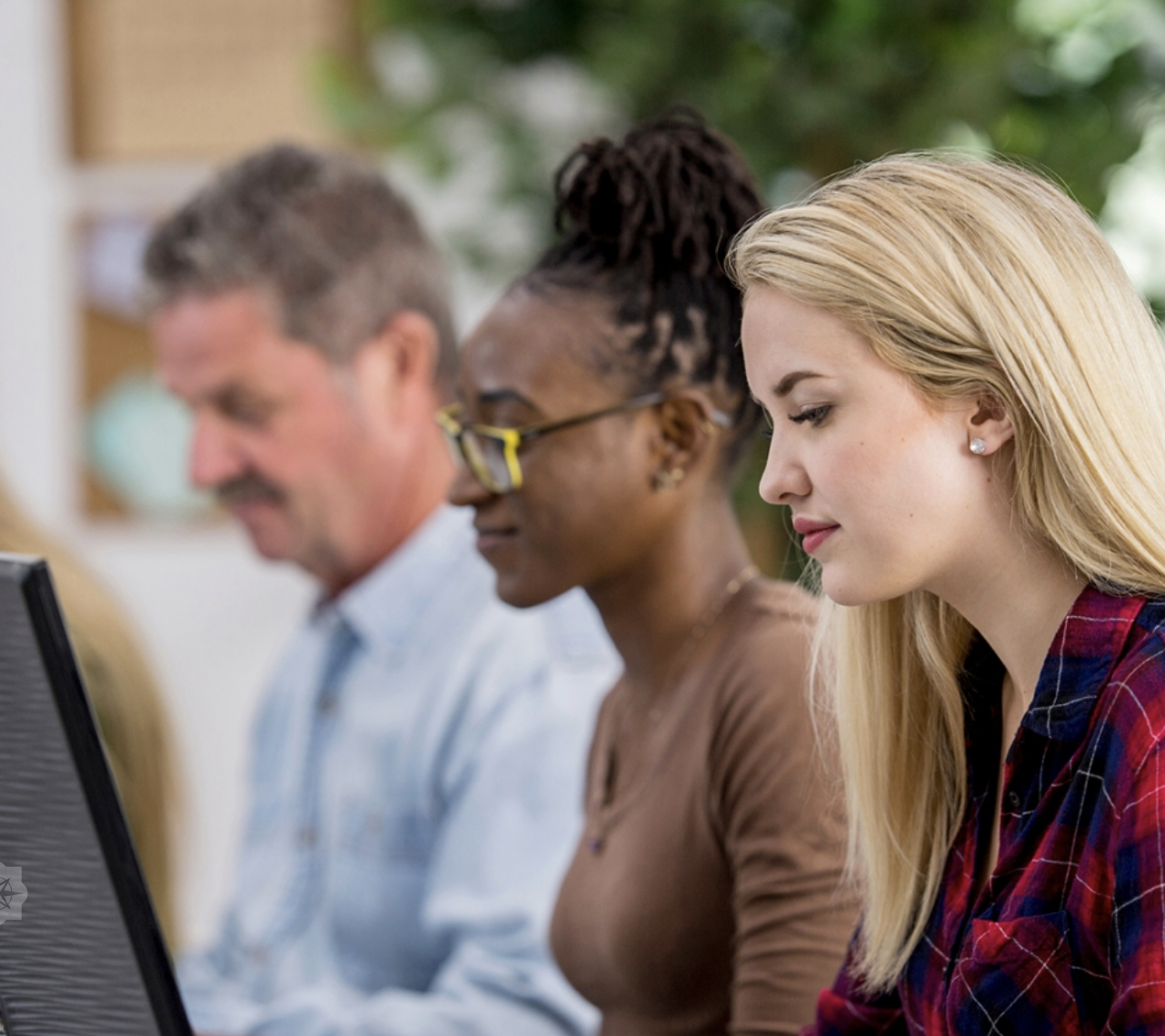 A male and two females taking part in online session