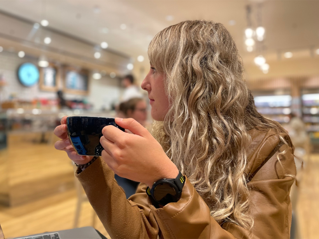 Young female drinking cup of coffee