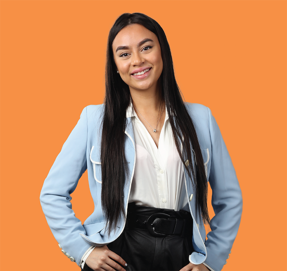 Young female pictured against orange background