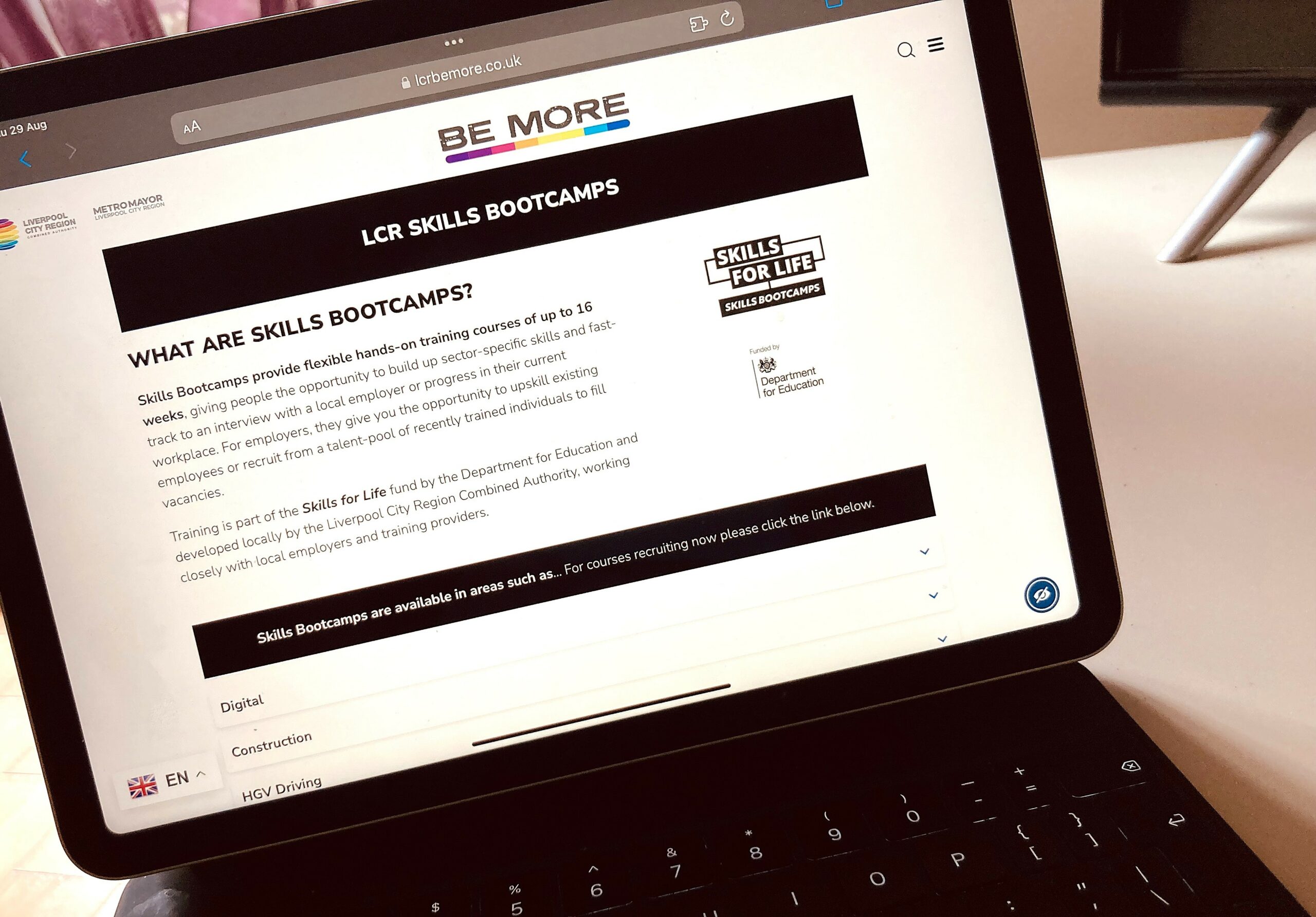 Image showing skills bootcamps webpage being displayed on laptop - black text on white background