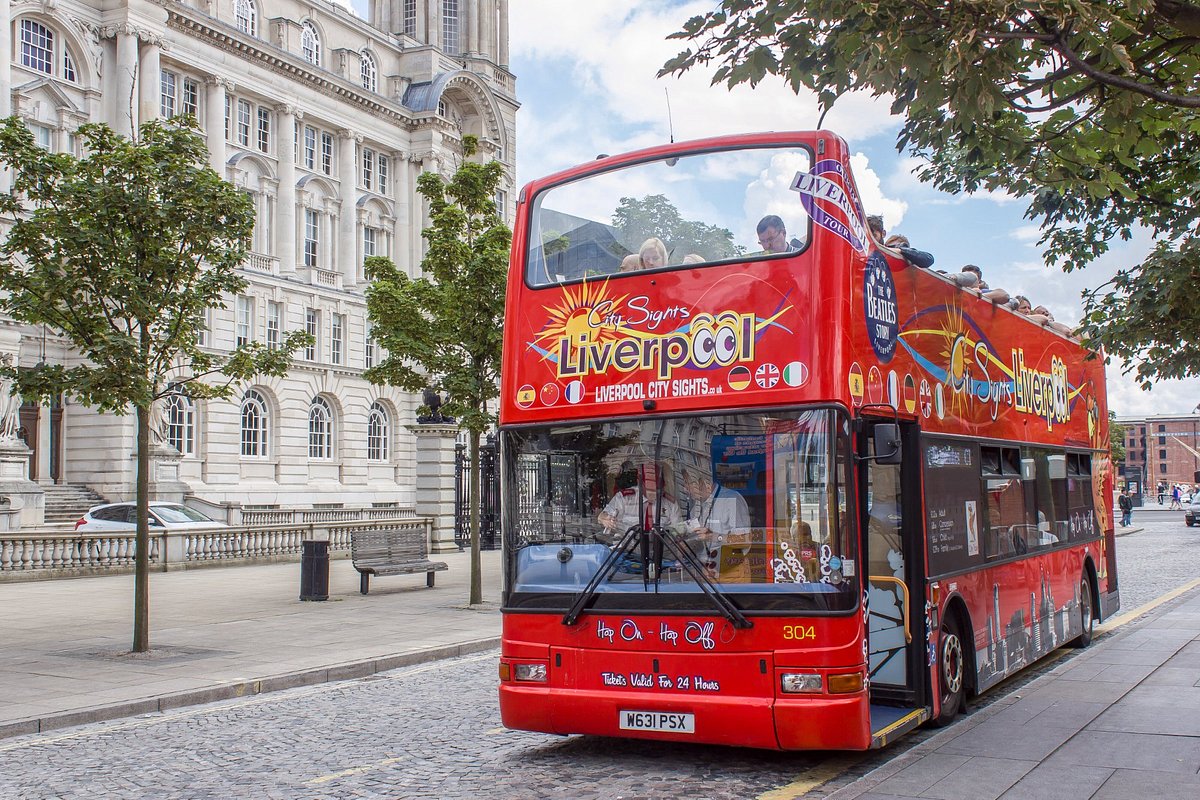 Red sightseeing open top bus in Liverpool